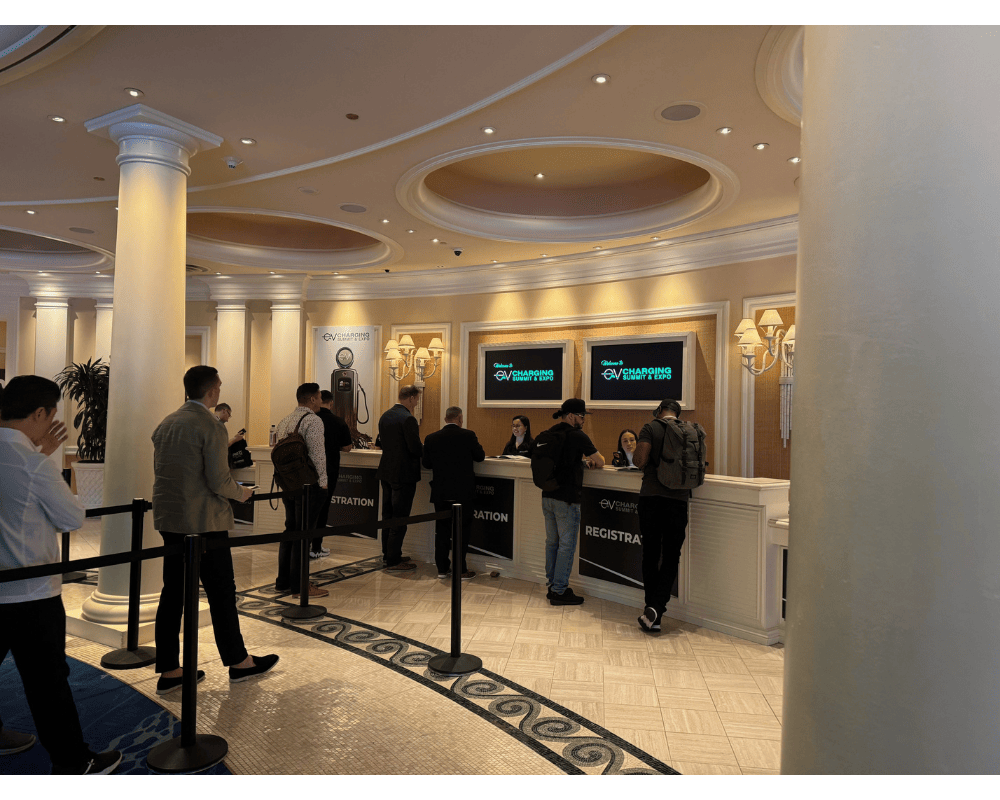 EV charging summit & Expo registration booth in the Caesars Palace lobby.