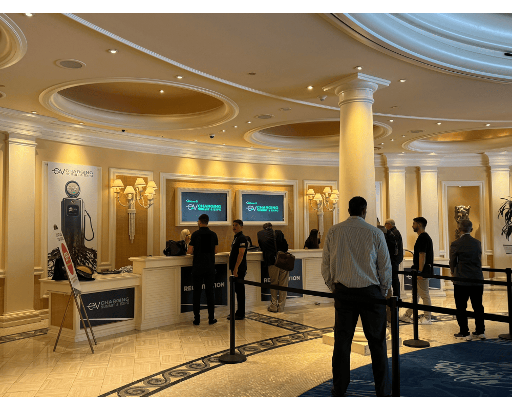 EV charging summit & Expo registration booth in the Caesars Palace lobby.